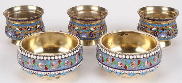 RUSSIAN SILVER & ENAMEL SALTS, CIRCA 1900: A GROUP OF FIVE RUSSIAN SILVER-GILT AND ENAMEL SALTS, MOSCOW, 1899-1908. Comprising two larger master salts banded in shaded enamel and the rim in beaded cloisonné enamel. Each hallmarked Moscow, ci