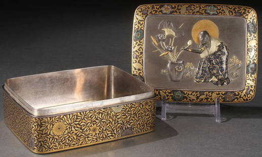 JAPANESE KOMAI-STYLE INLAID IRON BOX: AN EXTREMELY FINE JAPANESE INLAID IRON BOX IN THE KOMAI STYLE, MEIJI PERIOD. The rectangular silver lined iron box and over fitting lid with radiused corners inlaid with an allover pattern of dense fo