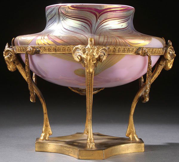 LOETZ STYLE ART GLASS CABINET VASE, CIRCA 1900: A FINE BOHEMAIN LOETZ STYLE ART GLASS AND GILT BRONZE CABINET VASE, CIRCA 1900. Modelled as a classical torchere. The glass insert of opalescent lavender glass decorated with gold iridized pulled fea