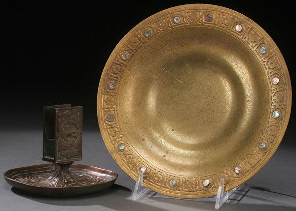 TIFFANY STUDIOS BRONZE ITEMS: A PAIR OF TIFFANY STUDIOS BRONZE TABLE ITEMS, EARLY 20TH CENTURY. Comprising an Abalone and dore low bowl, shape 1723, diameter 9 inches (22.7 cm) and a patinated 'Zodiac' match stand, shape 1041, hei