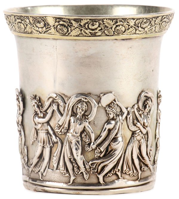 A RUSSIAN SILVER GILT TUMBLER, MOSCOW, 1831: A RUSSIAN SILVER GILT TUMBLER, MOSCOW, 1831. The cylindrical form with flared rim, set with a repeating pattern of chased, gilt roses and the sides banded with classical scenes of women dancing. Hallm