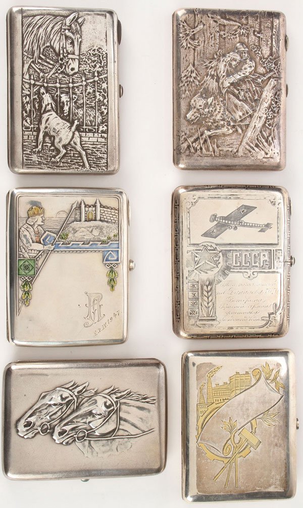 6 LATE SILVER RUSSIAN IMPERIAL & EARLY SOVIET CASES: AN INTERESTING GROUP OF SIX LATE IMPERIAL AND EARLY SOVIET RUSSIAN CIGARETTE CASES, CIRCA 1915-1940. Each of rectangular form with rounded edges and push button thumbpieces. The first with hinged lid 