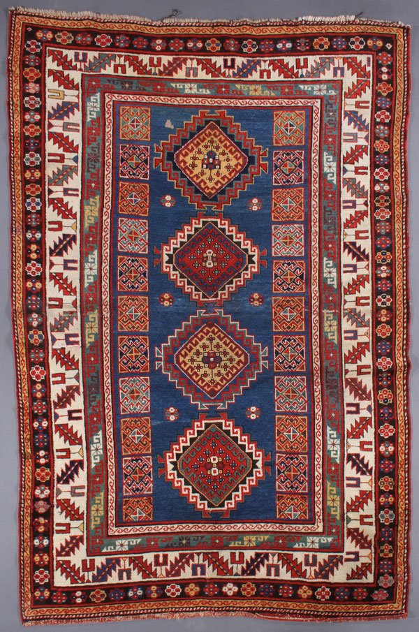 A GOOD KAZAK MOGHAN ORIENTAL RUG, CIRCA 1900-1910: A GOOD KAZAK MOGHAN ORIENTAL RUG, CIRCA 1900-1910. 4 feet 9 inches x 7 feet 3 inches (144.7 x 220.9 cm). Provenance: From the lifetime estate collection of Jose Antonio Danobeitia (1942-2011). Born in