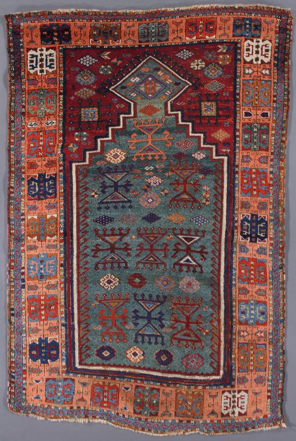 A TURKISH PRAYER RUG, FIRST QUARTER 20TH CENTURY: A TURKISH PRAYER RUG, FIRST QUARTER 20TH CENTURY. 3 feet 3 inches x 4 feet 11 inches (99 x 149.8 cm). Provenance: From the lifetime estate collection of Jose Antonio Danobeitia (1942-2011). Born in Sp