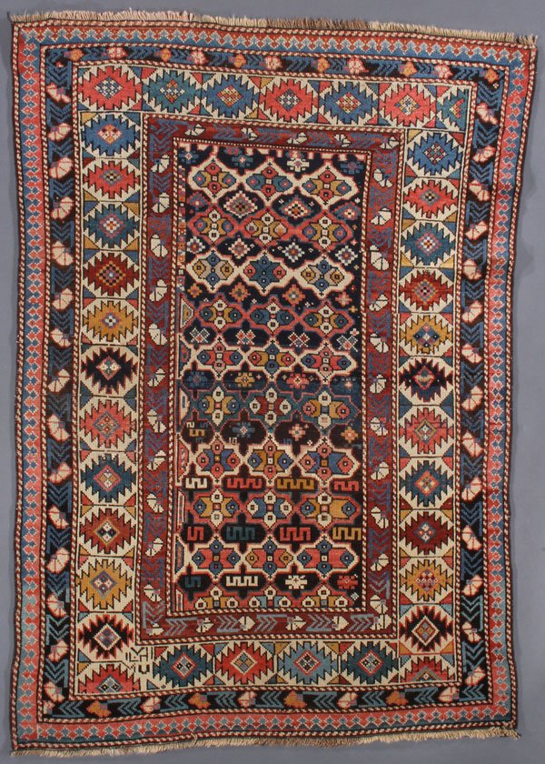 A SHIRVAN ORIENTAL RUG, EAST CAUCASUS, CIRCA 1910: A SHIRVAN ORIENTAL RUG, EAST CAUCASUS, CIRCA 1910. 3 feet 8 inches x 5 feet 2 inches (111.7 x 157.4 cm). Provenance: From the lifetime estate collection of Jose Antonio Danobeitia (1942-2011). Born in