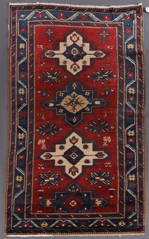 A KAZAK ORIENTAL RUG, SOUTHWEST CAUCASUS: A KAZAK ORIENTAL RUG, SOUTHWEST CAUCASUS, CIRCA 1920-1930. 3 feet 6 inches x 5 feet 11 inches (106.7 x 180.3 cm). Provenance: From the lifetime estate collection of Jose Antonio Danobeitia (1942-2011)
