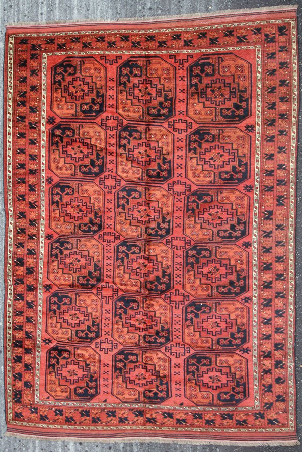 AN AFGHAN ORIENTAL RUG: AN AFGHAN ORIENTAL RUG, THIRD QUARTER 20TH CENTURY. With an Ersari design. 7 feet 1 inch x 8 feet 8 inches (215.9 x 264.2 cm). Provenance: From the lifetime estate collection of Jose Antonio Danobeiti