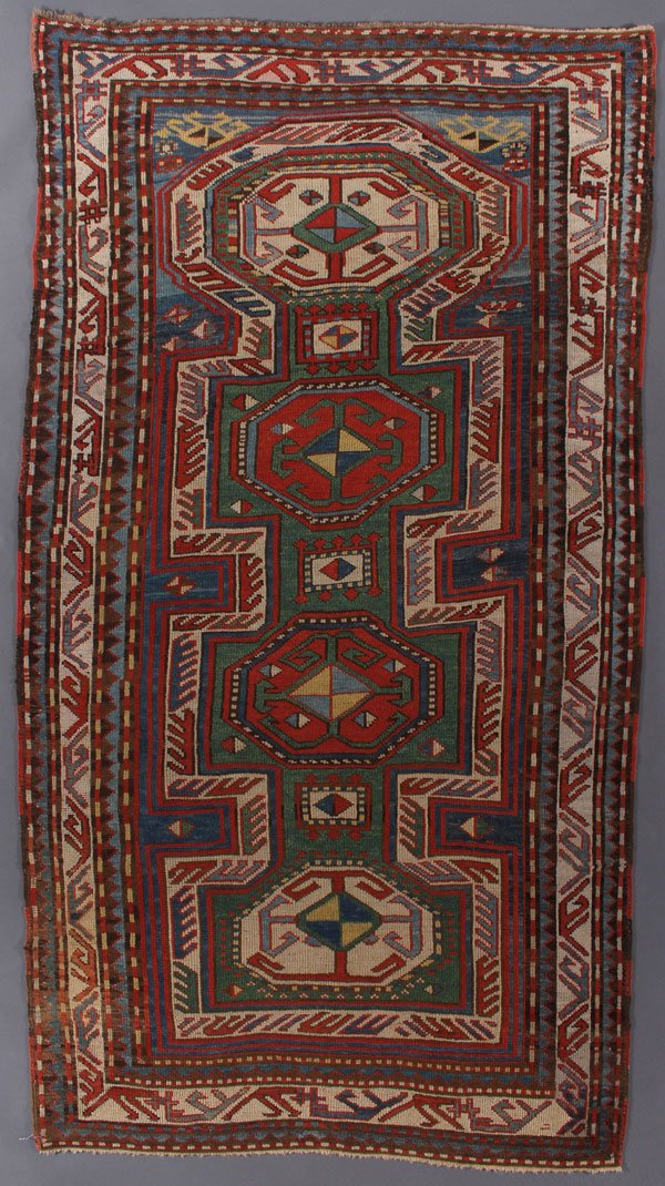 A KAZAK ORIENTAL PRAYER RUG, SOUTHWEST CAUCASUS: A KAZAK ORIENTAL PRAYER RUG, SOUTHWEST CAUCASUS, FIRST QUARTER 20TH CENTURY. 4 feet 4 inches x 8 feet (132.1 x 243.8 cm). Provenance: From the lifetime estate collection of Jose Antonio Danobeitia (19