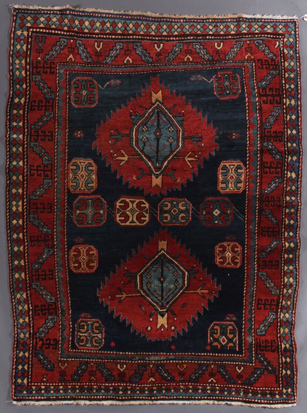 A CAUCASIAN KAZAK ORIENTAL RUG: A CAUCASIAN KAZAK ORIENTAL RUG, SECOND QUARTER 20TH CENTURY. 5 feet x 6 feet 6 inches (132.4 x 198.1 cm). Provenance: From the lifetime estate collection of Jose Antonio Danobeitia (1942-2011). Born i
