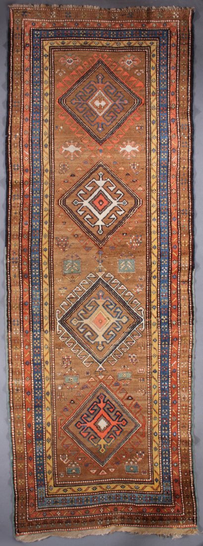 A CAUCASIAN ORIENTAL RUNNER: A CAUCASIAN ORIENTAL RUNNER, SECOND QUARTER 20TH CENTURY. 3 feet 6 inches x 9 feet 11 inches (106.7 x 302.3 cm). Provenance: From the lifetime estate collection of Jose Antonio Danobeitia (1942-2011).