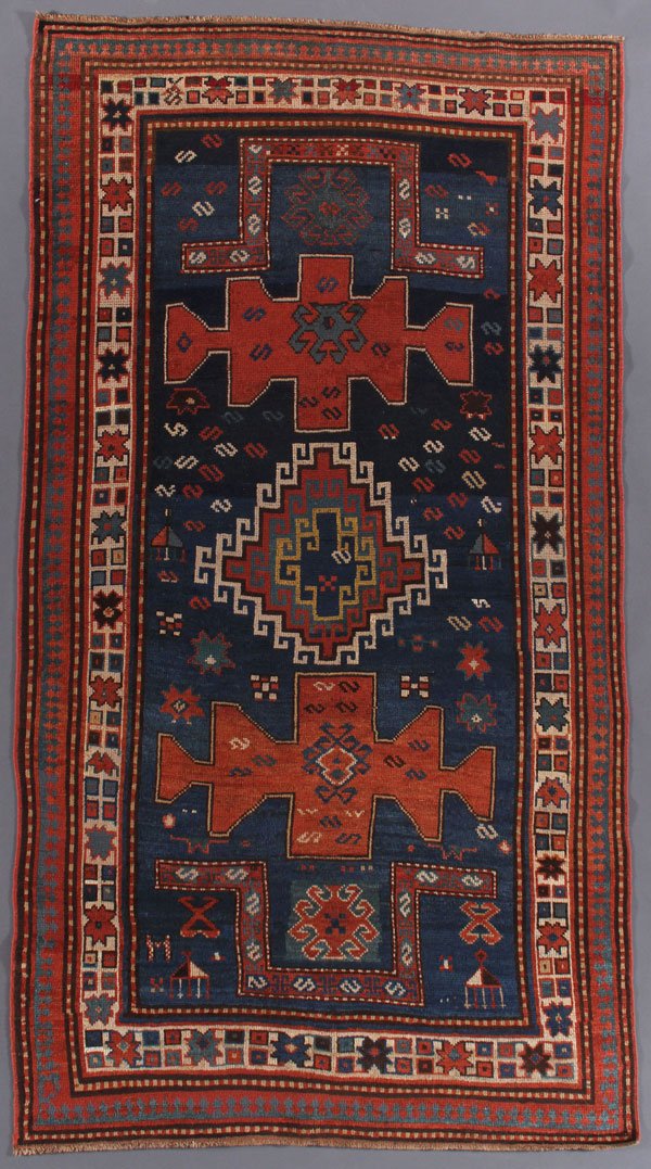 A KAZAK DOUBLE NICHE PRAYER RUG: A KAZAK DOUBLE NICHE PRAYER RUG, SOUTHWEST CAUCASUS, CIRCA 1900 OR BEFORE. With barber pole border intact. 3 feet 9 inches x 8 feet (114.3 x 243.8 cm). Provenance:From the lifetime estate collection o