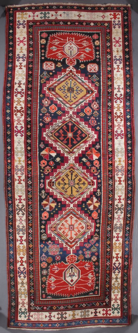 A CAUCASIAN SHIRVAN ORIENTAL RUNNER: A CAUCASIAN SHIRVAN ORIENTAL RUNNER, SECOND QUARTER 20TH CENTURY. 4 feet 2 inches x 10 feet 4 inches (127 x 304.8 cm). Provenance: From the lifetime estate collection of Jose Antonio Danobeitia (1942-
