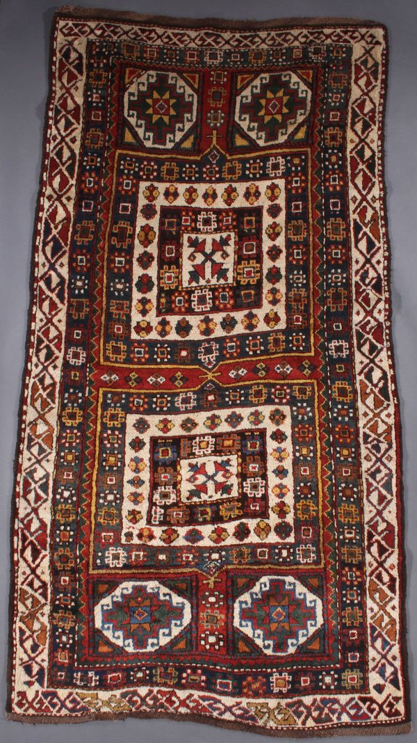 A TURKISH KAZAK ORIENTAL RUG, CIRCA 1940: A TURKISH KAZAK ORIENTAL RUG, CIRCA 1940. 4 feet x 7 feet 7 inches (121.9 x 238.7 cm). Provenance: From the lifetime estate collection of Jose Antonio Danobeitia (1942-2011). Born in Spain, Mr. Danobe