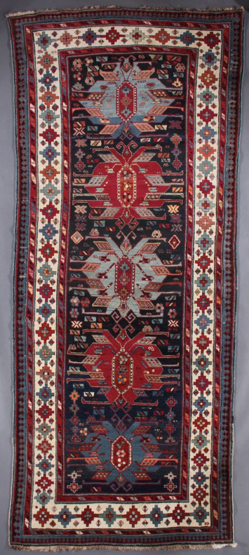A CAUCASIAN ORIENTAL RUNNER: A CAUCASIAN ORIENTAL RUNNER, SECOND QUARTER 20TH CENTURY. 3 feet 9 inches x 9 feet 5 inches (114.3 x 287 cm). Provenance: From the lifetime estate collection of Jose Antonio Danobeitia (1942-2011). Bo