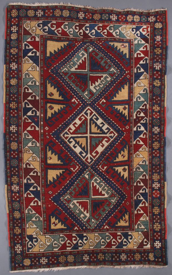 A CAUCASIAN ORIENTAL RUG, FIRST QUARTER 20TH C: A CAUCASIAN ORIENTAL RUG, FIRST QUARTER 20TH CENTURY. 3 feet 10 inches x 6 feet 4 inches (116.8 x 193 cm). Provenance: From the lifetime estate collection of Jose Antonio Danobeitia (1942-2011). Born 