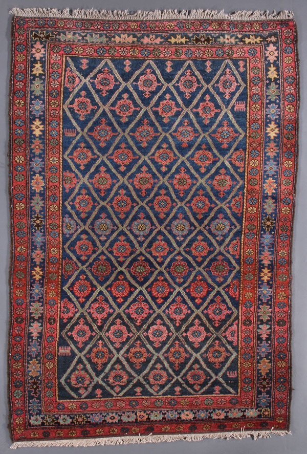 A PERSIAN HAMADAN RUG, CIRCA 1930'S: A PERSIAN HAMADAN RUG, CIRCA 1930'S. Lattice pattern. 3 feet 11 inches x 5 feet 9 inches (119.4 x 175.3 cm). Provenance: From the lifetime estate collection of Jose Antonio Danobeitia (1942-2011). Bor