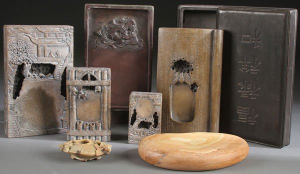 SIX FINELY CARVED ASIAN INK STONES 19TH & 20TH C.: A COLLECTION OF SIX ORIENTAL CARVED INK STONES, 19th & 20TH CENTURY. Each carved from various colored soapstone with scenic or trompe-l'oeil patterns, several with calligraphy inscriptions, the larges