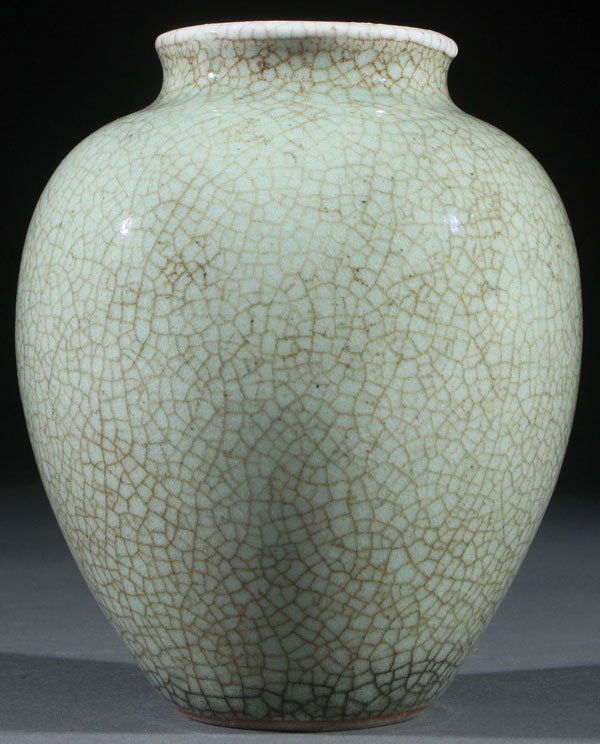 A CHINESE CELADON GLAZED REDWARE VASE: A CHINESE CELADON GLAZED REDWARE VASE. With crackled glaze. Height 5.25 inches (13.2 cm).