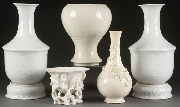 5 PC GROUP OF CHINESE WHITE GLAZED CERAMICS: A FIVE PIECE GROUP OF CHINESE WHITE GLAZED CERAMICS, 19TH/20TH CENTURY WITH SOME POSSIBLY EARLIER. Comprising a pair of matching vases each embossed with panels of flying cranes and with attached rot