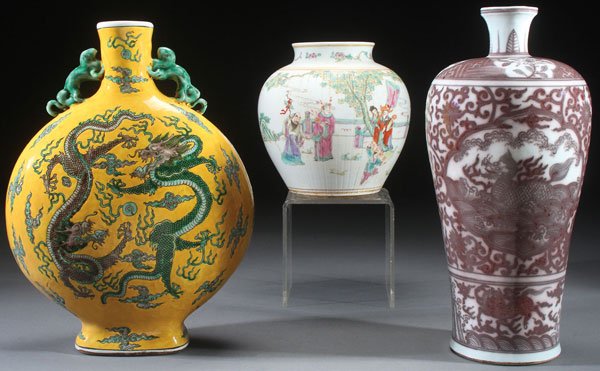 3 PC CHINESE FAMILLE ROSE AND COPPER RED: A THREE PIECE CHINESE FAMILLE ROSE AND COPPER RED GLAZED PORCELAIN GROUP. Comprising a large moon flask decorated with dragons on an imperial yellow ground, a Ming style copper red on white Meiping va