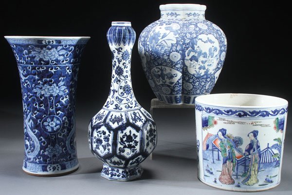 4 CHINESE BLUE & WHITE DECORATED PORCELAIN VASES: FOUR CHINESE BLUE AND WHITE DECORATED PORCELAIN VASES. Comprising a melon ribbed vase with figures and interlocking florals, a pear shaped Ming style bottle vase, a large dragon decorated beaker vase 