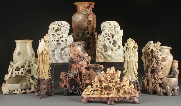 9 OLD IMPRESSIVE CHINESE CARVED SOAPSTONE PIECES: A NINE PIECE GROUP OF CHINESE CARVED SOAPSTONE, 19TH & 20TH CENTURY. Comprising four large vases with carved and pierced extending florals, two scenic carved bookends, a pair of Deities and other item