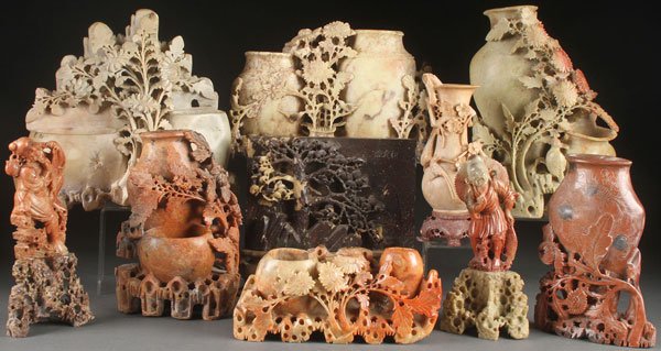 10 SPECTACULAR CARVED CHINESE SOAPSTONE PIECES: A TEN PIECE GROUP OF CHINESE CARVED SOAPSTONE, 19TH & 20TH CENTURY. Including vases with carved and reticulated floral decoration, a pine tree table screen and standing immortals. Largest height 10.5 