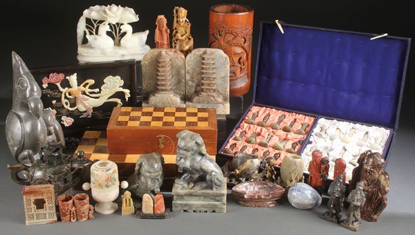 AN INTERESTING GROUP OF 25 MOSTLY ASIAN CARVED OBJECTS: AN INTERESTING GROUP OF 25 MOSTLY ASIAN CARVED OBJECTS, C. 1880-1975. Comprising primarily carved soapstone objects as well as other materials including a large carved stone figural bird grouping, eit