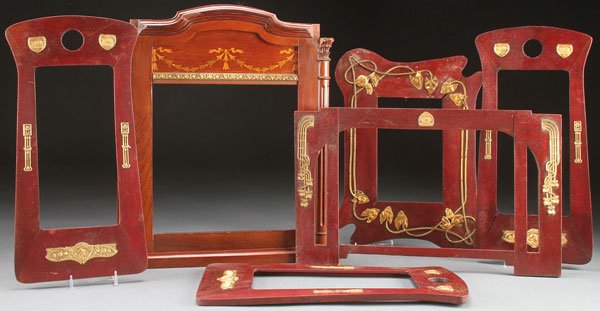 5 AUSTRIAN ART NOUVEAU PICTURE FRAMES: A COLLECTION OF FIVE AUSTRIAN ART NOUVEAU PICTURE FRAMES, LATE 19TH CENTURY. Each with gilt metal ornamentation on a shaped wood frame with mahogany stained finish. Comprising three matching rectangul