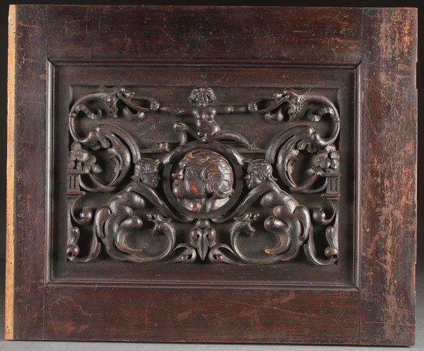 FOUR CARVED WOOD PANELS: A GROUP OF FOUR RENAISSANCE AND GOTHIC STYLE CARVED WOOD PANELS, 19TH CENTURY. All carved in deep relief. Comprising an oak cornice carved with scrolled acanthus, bird forms, rosettes and lions head m