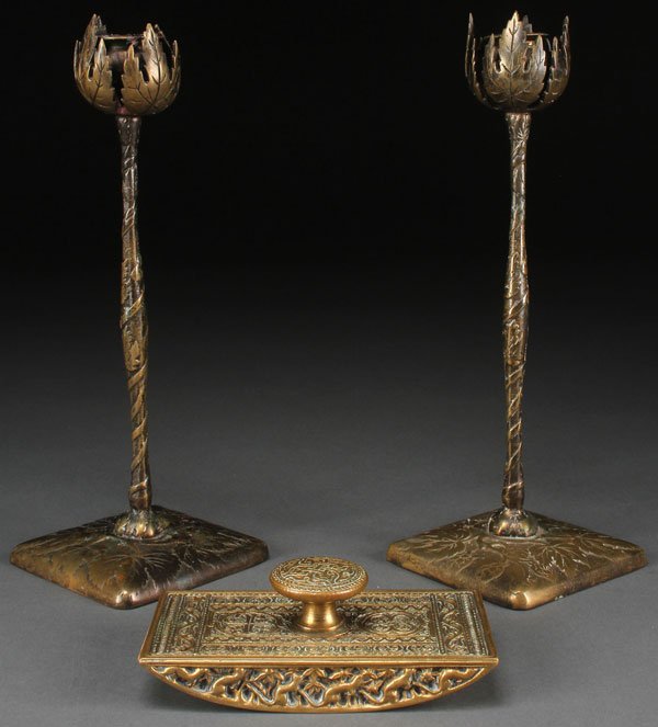 A TIFFANY "VENETIAN" BRONZE INK BLOTTER: A TIFFANY "VENETIAN" BRONZE INK BLOTTER, CIRCA 1900. Together with a pair of matching bronze Marshall Field and Company art metal craft hops and vine candlesticks. Height 10.75 inches.