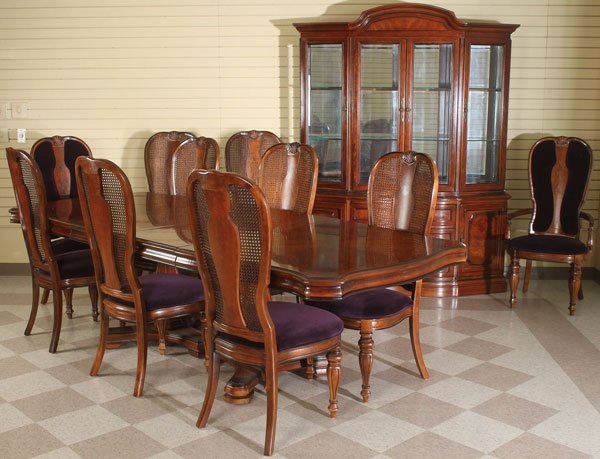 BERNHARDT 12 PIECE WALNUT DINING SUITE: A VERY FINE BERNHARDT 12 PIECE WALNUT DINING SUITE, LAST QUARTER 20TH CENTURY. In a traditional style comprising a two pedestal dining table, two host armchairs, eight cane back side chairs, each wit