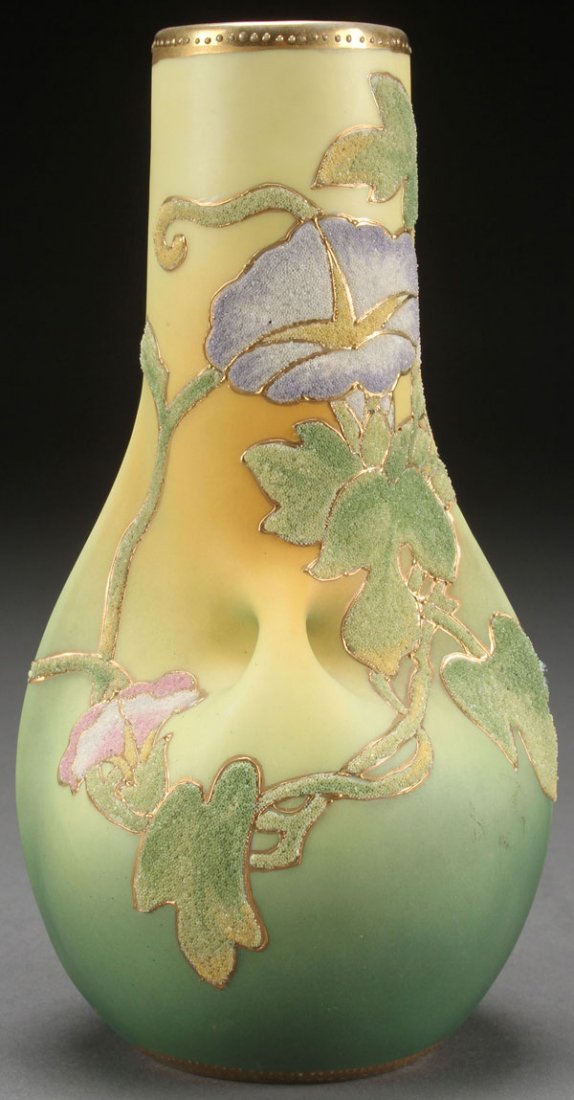 A FINE HAND PAINTED NIPPON CORALENE HANDLED: A FINE HAND PAINTED NIPPON CORALENE HANDLED VASE. With stylized floral decoration, 1909 U.S. patent mark. Height 8.5 inches (21.6 cm).