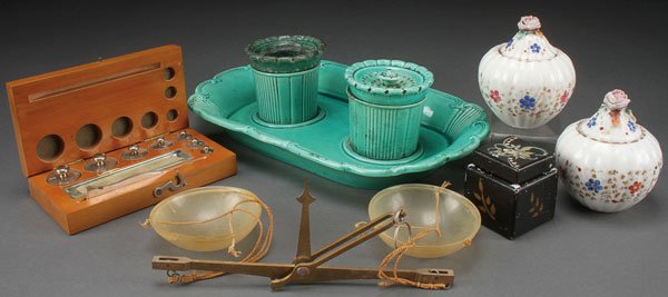 A GROUP OF 19TH CENTURY DESK ACCESSORIES: A GROUP OF 19TH CENTURY DESK ACCESSORIES. Comprising a mid-century Majolica ink stand with well and sander; a Jacob Petit porcelain inkwell and sander; a small porcelain covered inkwell; and a small