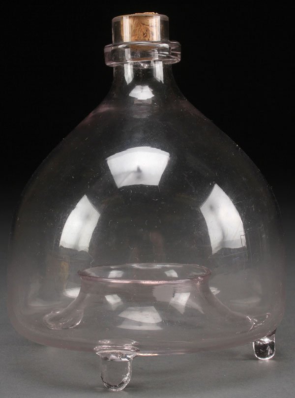 A RARE AMERICAN BLOWN GLASS FLY CATCHER, MID 19TH: A RARE AMERICAN BLOWN GLASS FLY CATCHER, MID 19TH CENTURY. Of squat bulbous form tapering to a short narrow neck with applied clear band and raised on three applied feet. Height 6 inches (15.2 cm).