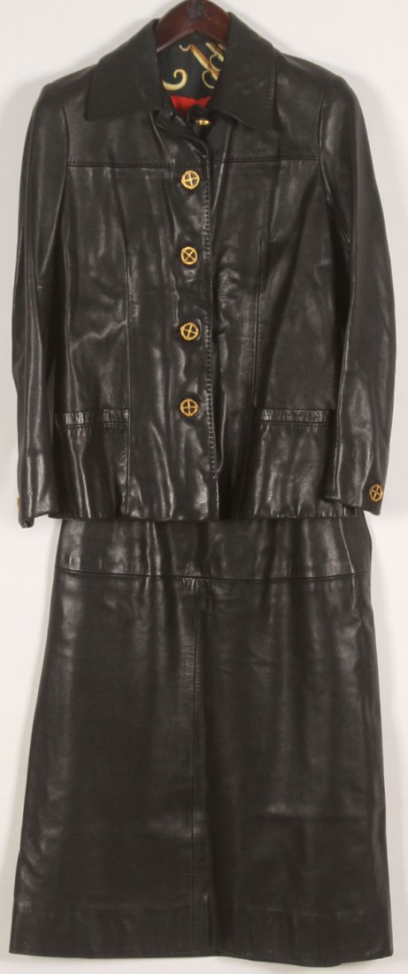 A PAIR OF LEATHER HERMES JACKET AND SKIRT SETS: A PAIR OF LEATHER HERMES JACKET AND SKIRT SETS, CIRCA 1970'S. Comprising a woman's approximately small, black leather, calf skin jacket with gilt wagon wheel buttons, the interior with a silk 1974 equ