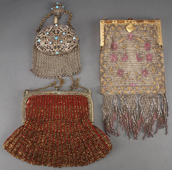 TWO BEADED GLASS PURSES, EARLY 20TH CENTURY: TWO BEADED GLASS PURSES, EARLY 20TH CENTURY. One with silvered ruby and gold colored beads on a jeweled gilt frame, one with copper luster beads on a crocheted ground together with a chain link mesh b
