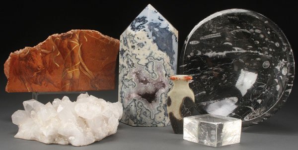 A SIX PIECE DECORATIVE SPECIMEN MARBLE & CRYSTAL: A SIX PIECE COLLECTION OF DECORATIVE SPECIMEN MARBLE AND CRYSTAL. Comprising a large cut and polished panel obelisk with exposed crystalline cavity, a white and black fossiliferous turned bowl, a cut 