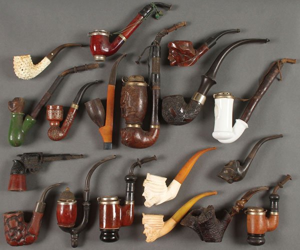 A COLLECTION OF CARVED BRIAR, MEERSCHAUM: A COLLECTION OF CARVED BRIAR, MEERSCHAUM, AND PORCELAIN VINTAGE SMOKING PIPES, 19TH AND 20TH CENTURY. 78 pipes including carved meerschaum figural busts, German and Black Forest style pipes including 