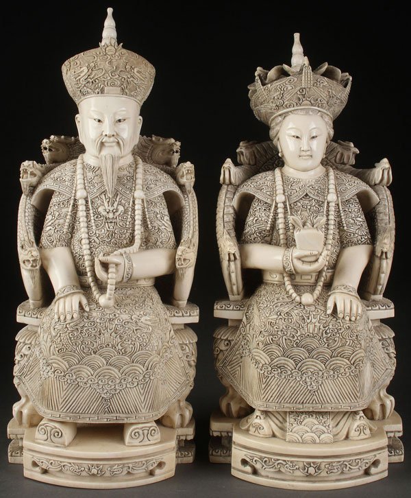 A PAIR OF LARGE AND IMPRESSIVE CHINESE CARVED IVORY: A PAIR OF LARGE AND IMPRESSIVE CHINESE CARVED IVORY EMPEROR AND EMPRESS, PROBABLY REPUBLIC PERIOD. Both finely carved in full round, seated on Imperial thrones and each wearing heavily embroidered Imp