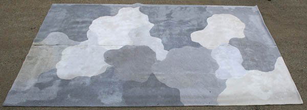 A LARGE EDWARD FIELDS WOOL CARPET circa 1996. Var: A LARGE EDWARD FIELDS WOOL CARPET circa 1996. Various gray tones in cloud like formation. 25' 7" x 16'. Center seam separated for transportation. Estimate $1,000-$2,000