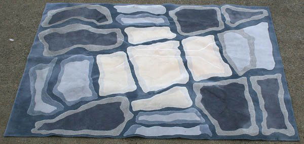 AN EDWARD FIELDS WOOL CARPET circa 1996. Undulati: AN EDWARD FIELDS WOOL CARPET circa 1996. Undulating fitted block design with sculpted texture in shades of gray. 16' 2" x 11' 9". Estimate $1,000-$2,000