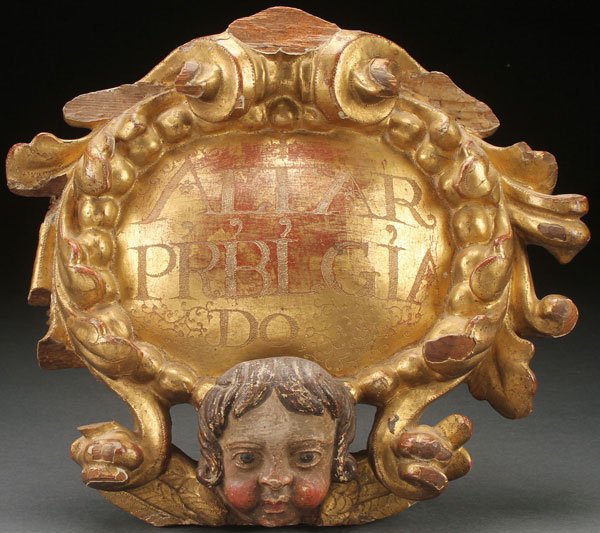 SPANISH COLONIAL CARVED GILT WOOD, 18TH C: AN INTERESTING SPANISH COLONIAL CARVED, POLYCHROME, AND GILT WOOD ALTAR ELEMENT, 18TH CENTURY. Carved in high relief, the oval domed central reserve gilded and incised in Latin “ALTAR PRBL GIA DO”