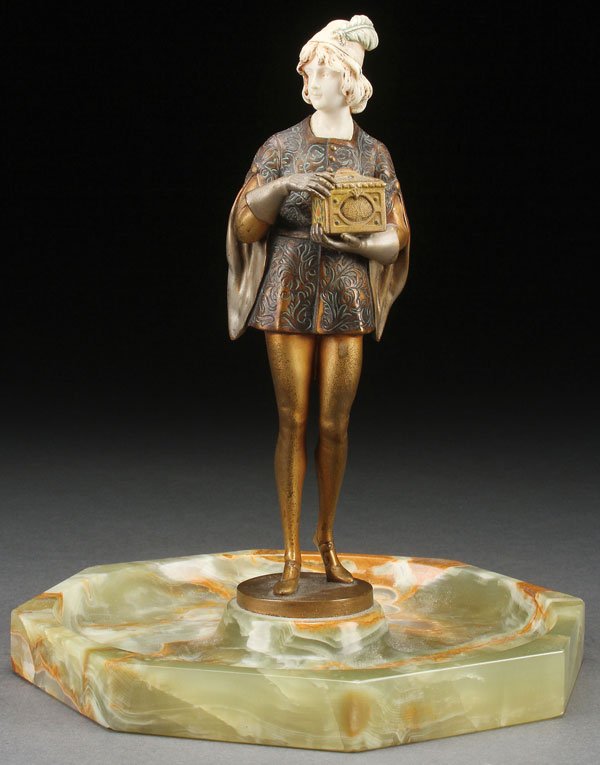 GILT BRONZE & IVORY, H. KECK, CIRCA 1920: HANS KECK(German 19th/20th century)A Medieval Prince Holding a Jeweled Casket- circa 1920 Cold painted gilt bronze and ivory on carved onyx octagonal hallowed baseInscribed on base "H. Keck"Overall he