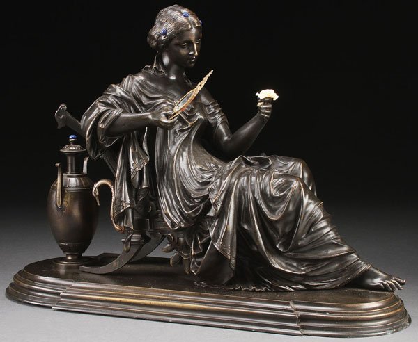 19TH CENTURY FRENCH BRONZE SIGNED PEIFFER: AUGUSTE JOSEPH PEIFFER(French 1832-1886) A Classical Maiden Reclining on a Lounge Contemplating a Flower Bronze with dark brown patina Inscribed on back of chair "PEIFFER" Length 17.25 inches (43.8 cm