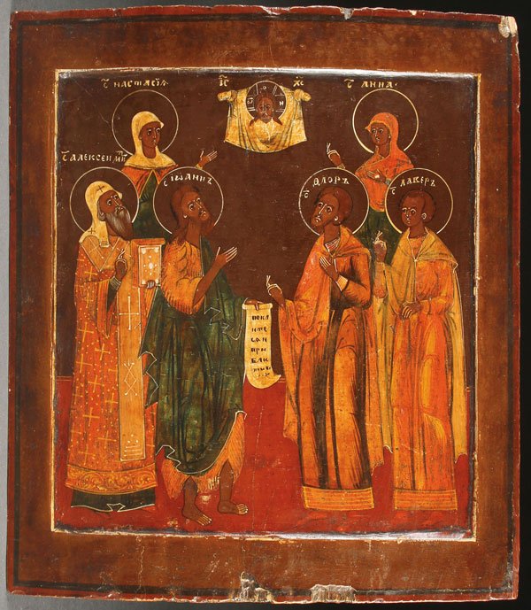 PAIR OF RUSSIAN ICONS, 19TH CENTURY: A PAIR OF RUSSIAN ICONS, 19TH CENTURY. The first depicting six saints beneath the Holy Visage including Saints Anastasia, Alexei of Moscow, John the Baptist, Florus, Laurus and Anna; the last three ho