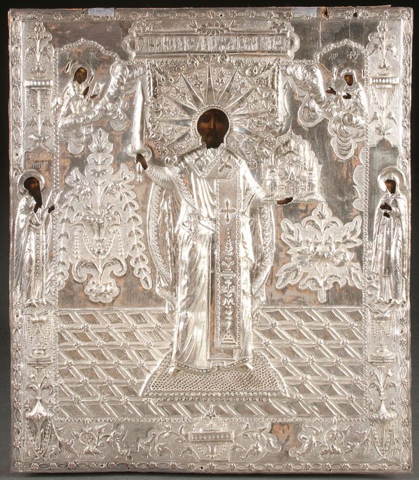 RUSSIAN ICON, ST NICHOLAS, DATED 1801: A RUSSIAN ICON OF ST. NICHOLAS OF MOZHAISK, CIRCA 1800. Overlaid with an ornate silver, repoussé, and chased riza, hallmarked Yaroslavl, dated 1801, Cyrillic maker’s mark AL and 84 silver standard,