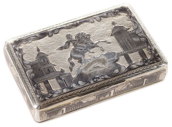 RUSSIAN SILVER & NIELLOED SNUFF BOX, 1829: A RUSSIAN SILVER GILT AND NIELLOED SNUFF BOX, MOSCOW, 1829. The hinged lid nielloed with The Bronze Horseman (Peter the Great), the sides banded with cityscapes, the verso with military trophies on a