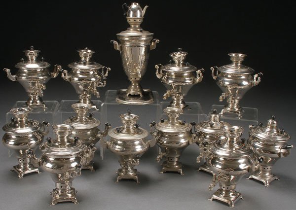 13 RUSSIAN SOVIET MINIATURE SAMOVARS: A GROUP OF RUSSIAN SOVIET PERIOD NICKEL PLATED MINIATURE SAMOVARS, CIRCA 1975-1985. Comprising 13 functional samovars, various makers, each with spigot, handles, covers, and together with three undert