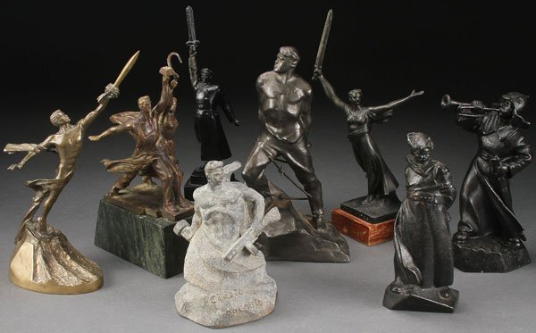RUSSIAN SOVIET PATRIOTIC THEMED SCULPTURES: A GROUP OF EIGHT RUSSIAN SOVIET PATRIOTIC THEMED DESK SCULPTURES, CIRCA 1960-1985. Depicting soldiers and citizens expressing victory or Soviet idealistic themes. Various materials including brass, al
